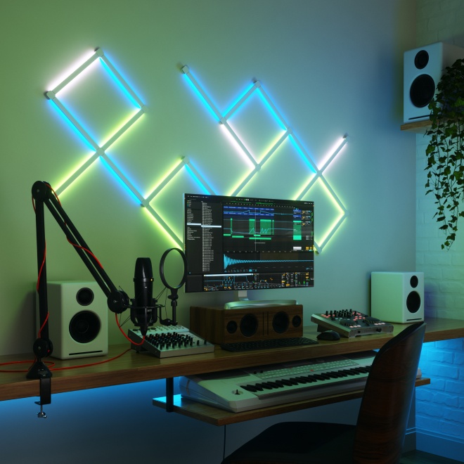 Office bedroom setup with Nanoleaf Lines RGB lights mounted above the desk and monitor. The perfect gaming lights for your PC battlestation.