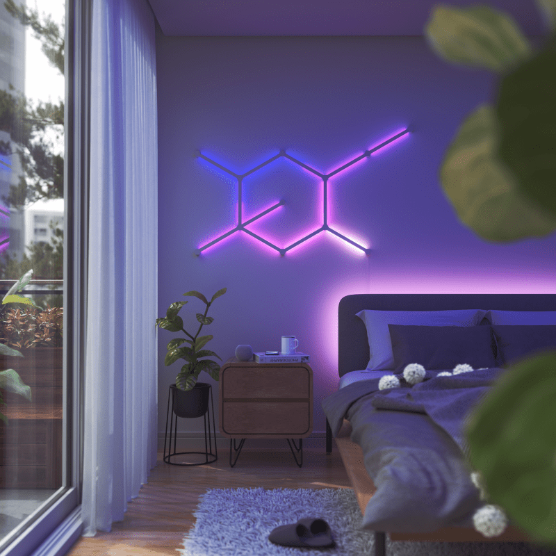 Nanoleaf Lines Thread enabled color changing smart modular backlit light lines mounted to a wall in a bedroom. HomeKit, Google Assistant, Amazon Alexa, IFTTT.